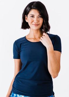 Adele Swim Top Fit & Sizing Tight Fit Sleeve Length 6.25” (Size S) Top Length 26.2” (Size S) If you are between sizes, or in doubt, please size up. Features Short Sleeve Round Neckline Does not feature a Built-in Bra Side ruching creates a flattering cinched look UPF50+ Sun Protection Quick Dry Care Rinse in cold water to wash off any chemicals, chlorinated water or saltwater Machine wash in cold water on gentle cycle Lay flat to dry in the shade Material 8 Swim Capris, Swim Skort, Crop Swim Top, Swim Leggings, Swim Bra, Vintage Swim, Beautiful Red Hair, Sports Skirts, Swim Skirt