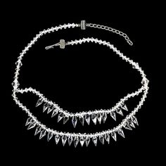 This is part of Chairish’s Costume Jewelry assortment. Elegant 16-Inch Evening Necklace with Sparkling Crystals – Perfect for Cocktail Parties  Make a dazzling statement at your next evening event with this elegant 16-inch necklace featuring one and a half strands of sparkling, glittering crystals. The brilliant crystals catch the light from every angle, adding a touch of luxury and sophistication to any outfit.  Ideal for cocktail parties, this necklace effortlessly enhances your evening look w Sparkling Choker Necklace For Party, Silver Double Strand Necklaces For Evening, Silver Double Strand Necklace For Evening, Formal Silver Crystal Beaded Necklaces, Silver Crystal Necklace With Bling For Evening, Silver Crystal Necklaces With Bling For Evening, Glamorous Party Crystal Necklaces With Jewels, Elegant Crystal Necklaces With Bling For Parties, Silver Backdrop Necklace With Sparkling Stones For Party