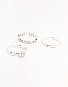 Revamp your style with our Silver Plated Fine Round Cubic Zirconia Stacking Rings 3-Pack. Featuring shimmering cubic zirconia stones, they offer a dazzling effect. Wear them solo or stacked for a sophisticated look that complements any outfit. Material: Cubic Zirconia, Silver Plated Dimensions: Diameter 16 mm x Band Width 2 mm | Lovisa Silver Plated Fine Round Cubic Zirconia Stacking Rings 3-Pack Three Rings, Stacking Rings, Sophisticated Look, Fashion Rings, Silver Plate, Silver Plated, Cubic Zirconia, Plating, Your Style