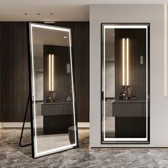 a large mirror sitting in the middle of a room next to two sinks and mirrors