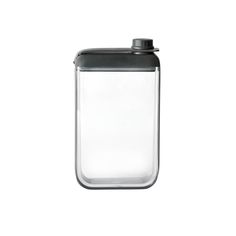 a glass container with a black lid on a white background