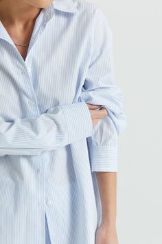 Slightly more oversized than our other cotton button up shirts. It's a lightweight airy cotton oversized shirt. A relaxed fit with pointed collar details and cool curved hemline.