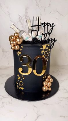 a black and gold birthday cake with the number 30 on it