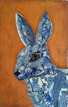 a painting of a blue and white rabbit on an orange background, with one eye in the center