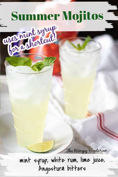 two glasses filled with lemonade and mint sitting on top of a white plate next to each other