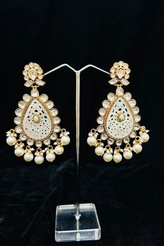 Description: Enhance your elegance and make a statement with our Gold Plated Dazzling Royal Kundan Beaded Earrings. The intricate design and sparkling kundan beads add a touch of royalty to your outfit. Perfect for any occasion, these earrings will surely impress. About: Best for gifting or for personal use, wear it to any occasion and be the spotlight. Eye-catching and unique jewelry that will set you apart. Gift this piece to a loved one and see their face light up with joy. Sequence Blouse, Saree Petticoat, Silver Pooja Items, Full Sleeve Blouse, Chikankari Suits, Belt Blouse, Glass Bangles, Lehenga Skirt, Silver Toe Rings