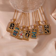 These stunning and colorful tarot card necklaces are as beautiful as they are magical. Wear them to manifest the meaning of each card. ﻿BUY 2 GET 1 FREE! Pendant Size: 19mm*11mm Material: 18K Gold Plated over Stainless Steel. Finished with anti-tarnish processing (allergic skin safe + nickel and lead-free). Does not tarnish. Luxury Gemstone Amulet Jewelry, Luxury Red Amulet Necklace, Cheap Spiritual Locket Necklace, Necklaces On Playing Cards, Tarot Card Necklace, Knight Of Cups, Card Necklace, Inner Guidance, Amulet Necklace