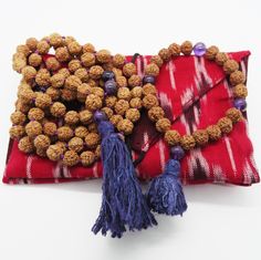 Beads: Rudraksha seedsStone: AmethystMeaning: Stability, strength and healingChakra: Crown (7th)Tassel: Ahimsa silk, cruelty-free Traditional Mala With Natural Stones For Meditation, Bohemian Hand Wrapped Mala For Meditation, Bohemian Mala For Festivals Gift, Bohemian Mala For Festivals As Gifts, Spiritual Hand Knotted Mala As Gift, Adjustable Artisan Mala As A Gift, Holistic Hand-strung Mala As Gift, Ritual, Cruelty Free