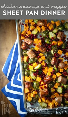 a sheet pan filled with sweet potatoes and brussel sprouts, topped with pomegranate