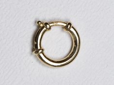 ♥ This is a 14k gold large spring ring / sailor clasp ♥ Use this to connect two chains together, or as the clasp for a statement necklace ♥ Out diameter of the spring ring measures 13mm ♥ The necklace chain is *NOT INCLUDED*. You can purchase the solid 14K gold chain as an option, or use one of your existing chains for the pendant. ♥ Material: 14K gold ♥ Free shipping in the US. ♥ This item is made-to-order and non-refundable. Please refer to our Shop Announcement section to see the latest produ 14k Gold Jewelry With Gold Clasp For Anniversary, Fine Jewelry Huggie With Spring Ring Clasp, Classic Hoop Rings With Spring Ring Clasp, Classic 14k Gold Jewelry With Lobster Clasp, Luxury Round Jewelry With Gold Clasp, Heirloom Gold Jewelry With Box Clasp, Timeless Yellow Gold Jewelry With Box Clasp, Luxury 14k Gold Jewelry With Spring Ring Clasp, 14k Gold Jewelry With Box Clasp For Gift