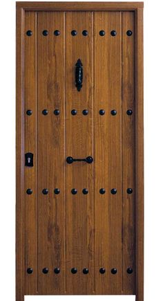 a wooden door with many black knobs on the front and side panels that have holes in them