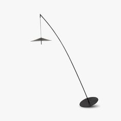 a black floor lamp with two lights on each side and one light on the other