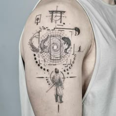 a man's arm with an abstract tattoo design on the upper half of his arm