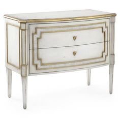 a white and gold painted chest with two drawers on one side and an open drawer on the other