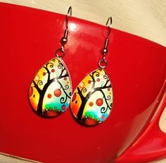 Polish Folk Art Tree themed handmade glass earrings. Artistic, colorful earrings. Perfect gift and choice for any occasion. Great Gift for Art Lovers, Folk Art enthusiast. Measures 0.98 inches in length and 0.70 inches in width. Comes with First Class Free shipping. Colors may vary due to monitor and lighting differences. Polish Folk Art, Art Enthusiast, Polish Folk, Broken Arrow, Art Tree, Earring Tree, Gifts For Art Lovers, Colorful Earrings, Boho Gifts