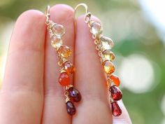 THE JEWELRY IS SHIPPED via DHL EXPRESS (2-5 days delivery door to door). THE DHL SHIPPING COST IS INCLUDED IN THE PRICE. The Sunset Earrings - Solid Gold 14K Multi Gemstone Orange Red Drop Colorful Earrings► Measurements / Details:- Length of the earrings including earwires: 2.17" (~5.5 cm)- Gold: All the components are 14K SOLID GOLD (stamped on the earwires)► Gemstones:The Earrings include excellent AAA quality gemstones, superbly faceted and vibrant:~ Lemon Quartz drops~ Citrine drops~ Padpar Teardrop Multi-stone Earrings As A Gift, Multi-stone Long Drop Jewelry Gift, Long Drop Multi-stone Earrings For Gift, 14k Gold Multi-stone Earrings Gift, Sunset Earrings, Gemstone Jewelry Earrings, Carnelian Earrings, Romantic Earrings, Earrings Tutorial