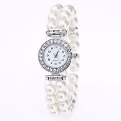 A lovely collection of classic Ivory pearl beads. Sparkling crystal dividers contrast against the creamy pearl texture. The watch bezel is a halo of matching crystals. So versatile! The perfect accessory for any formal occasion or for a glamorous costume! Stretch style to fit most wrist sizes. Occasion: Great for any Occasion such as Birthdays and Holidays, Wedding Accessories. Material: Simulated Pearls Watch Face: 25mm Length: Elastic/stretch to fit most sizes Comes in a gift box for easy gift Young Adult Outfits, Cher Fashion, Prom Fits, Casual Pearls, Shimmer Eye Makeup, Pretty Watches, Galaxy Jewelry, Pieces Outfits, Simple Watches