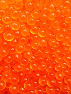 an orange background with lots of bubbles in it