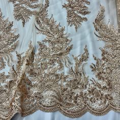 This elegant Beaded and Corded Bridal Lace Fabric from Lace USA is the perfect touch for any special occasion. Made from 100% polyester net mesh, this luxurious fabric is embroidered with stunning beads and cords and is sure to be a show-stopper at any dance, wedding, or costume event. Whether you're shopping for couture fabric or searching for the perfect fabric for a dancewear masterpiece, this bridal lace fabric is perfect for adding a regal touch to any garment. Shop with confidence and let Quinceanera Crown, Couture Fabric, Bridal Lace Fabric, Luxurious Fabric, Bridal Tiara, Champagne Color, Bridal Lace, Rose Gold Color, Ivory Color