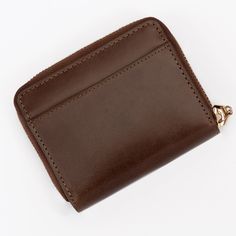 Zip Up Your Essentials in Style: The Mini Brown Leather Wallet for Women This mini zip-around wallet is crafted from smooth genuine brown leather and designed specifically for the modern woman on the go. It's the perfect blend of functionality and fashion, keeping your essentials organized and secure without weighing you down. Here's why you'll love it: Secure zip closure keeps your belongings safe and protected. Multiple card slots offer ample space for credit cards, IDs, and loyalty programs. Classic Leather Coin Purse With Card Slots, Leather Bifold Coin Purse With Rfid Blocking, Classic Leather Coin Purse With Rfid Blocking, Classic Rfid Blocking Coin Purse For Everyday, Classic Compact Trifold Wallet For Daily Use, Luxury Smooth Grain Wallets As Gift, Brown Bifold Coin Purse For Business, Classic Coin Purse With Rfid Blocking For Daily Use, Classic Leather Coin Purse With Interior Card Slots