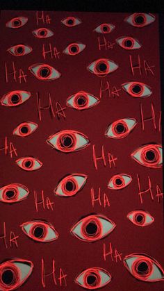 an eye pattern made out of red paper with words written in the middle and eyes drawn on it