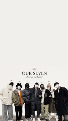 a group of people standing next to each other in front of a white wall with the words our seven on it