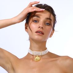 This elegant pearl choker features a gold-plated seashell-shaped pendant, making it a sophisticated addition to any jewelry collection, also perfect for summer wear. Shell jewelry Handcrafted from real sea pearls with 24k Gold plated brass seashell charm Nickel, lead and cadmium free Lobster clasp  Care To prevent oxidization and maintain long durability, keep your jewelry free of perfume, lotions, and sprays while using. It is advised to remove your gold-plated jewelry before showering. Make su Elegant Mother Of Pearl Shell With Pearl Pendant, Elegant Shell With Pearl Charm, Elegant Shell-shaped Pearl Drop Necklace, Elegant Shell-shaped Earrings With Pearl Charm, Luxury Pearl Choker Necklace, Elegant White Shell With Pearl Pendant, Elegant Shell-shaped Necklace With Pearl Charm, Elegant Pearl Shell With Pearl Drop, Elegant Gold Shell With Pearl Charm