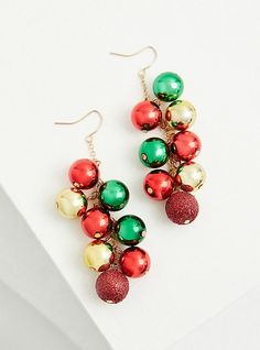 These shaky dangle earrings with red, green, and gold ornaments are perfect for accessorizing during the holiday season. French hook back. Gold tone dangle chains. Base metal. Imported. The best plus size women's red gold and green holiday ornaments shaky dangle earrings in multi. Torrid is your destination for cozy fall and winter clothes to keep you warm and comfortable. Gold Dangle Earrings For Holiday, Red Dangle Holiday Jewelry, Festive Holiday Jewelry With Dangle Shape, Festive New Year Dangle Jewelry, Festive Holiday Dangle Jewelry, Christmas Party Jewelry With Dangling Beads, Red Jewelry For New Year's Party, Red New Year Party Jewelry, Red Jewelry For New Year Party