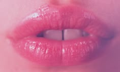 a woman's lips with pink lipstick on them