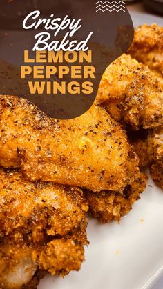 crispy baked lemon pepper wings on a white plate with text overlay that says crispy baked lemon pepper wings