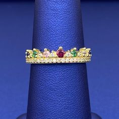 A beautiful combination of vibrant cubic zirconia stones in this crown ring. This ring is available in 10k yellow gold. Metal: 10k GoldStone: Cubic ZirconiaType: RingSize: 7 West Indian Bangles, Picture Pendant, Color Stones, Women's Rings, Crown Ring, Solid Gold Rings, Stone Gold, Gold Stone, Jewelry Gift Box