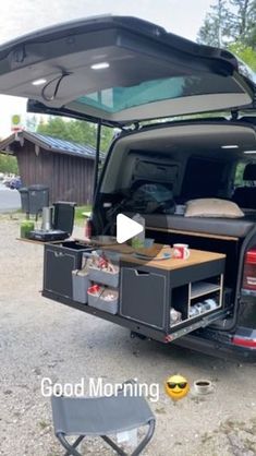 the back end of a truck with its trunk open and food in it's cargo compartment