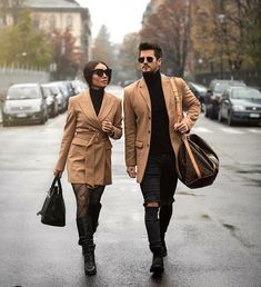 a man and woman walking down the street