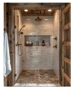 a walk in shower sitting inside of a bathroom