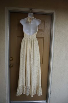 "Lovely lace prairie dress. Has the Gunne Sax style and look. No tags. Maxi length. Estimated size Small. Zips in back. Condition is good -no flaws to note! measurements taken across front lying flat Length50\" armpit to bottom Bust16.5\" laying flat Waist12.5\" empire Hips30\"" Beige Lace Floor-length Maxi Dress, Formal Maxi Dress With Delicate Lace, Spring Cream Backless Maxi Dress, Delicate Lace Floor-length Maxi Dress, Lace Maxi Dress With Lace Trim And Empire Waist, Empire Waist Lace Maxi Dress With Lace Trim, Lace Maxi Dress With Empire Waist And Lace Trim, Beige Lace Maxi Dress For Wedding, Beige Lace Maxi Wedding Dress