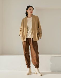 Oversized Stand Collar Outerwear For Work, Oversized Khaki Outerwear For Fall, Casual Cotton Blazer For Fall, Oversized Khaki Blazer For Winter, Fall Cotton Khaki Blazer, Fall Khaki Blazer With Pockets, Oversized Khaki Outerwear With Stand Collar, Casual Beige Blazer For Fall, Beige Stand Collar Blazer For Fall