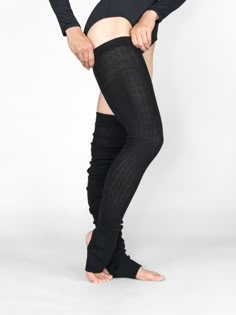 Soft, practical extra long leg warmers with open heel and soft touch feel. They are an absolutely fabulous fit and are worn by professionals around the world. Layer on top of your favorite Body Wrappers tights for a great look while increasing warmth. A must have for all ballet dancers and beyond. 48" extra-long stirrup thigh warmers. Fabric: Acrylic Style: 92 High Stretch Knee-high Leg Warmers, Solid Color Fitted Thigh High Socks, Stretch Footless Leg Warmers For Winter, Stretch Full-length Leg Warmers For Winter, Stretch Full Length Leg Warmers For Winter, Stretch Full-length Winter Leg Warmers, Trendy Stretch Knee-high Leg Warmers, Fitted Footless Leg Warmers For Winter, Fall High Stretch Footless Leg Warmers