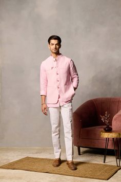 Crafted from cool and comfortable linen fabric in a delicate shade of lotus pink, Sarang exudes a sense of understated luxury. The true charm of this band lies in the meticulous dark pink tonal detailing that adorns the fabric. 100% linen  #philocaly #menswear #menstyle #kurta #bandiset #mensstyle #mensfashion #bespoke #weddingoutfitindian Men Indian Wear, Pink Shirt Outfit Men, Linen Outfit Men, Indowestern Outfits For Men, Kurta Designs Men's, Indowestern Outfits, Wedding Outfits Indian, Pink Shirt Men