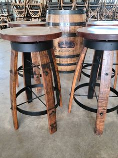 three wooden stools sitting next to each other