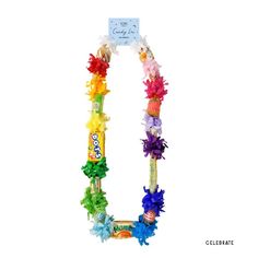 an assortment of different colored flowers on a white background with a sign in the middle