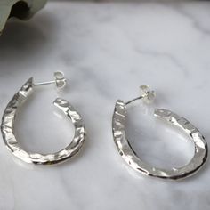 Carved Oval Hoop Earrings -  Oval Hoops - Recycled Sterling Silver - Simple Minimalist Earrings - Texture Earrings - Statement Hoop Earrings --- Carved Oval Hoop Earrings --- These hand carved oval hoop earrings have been created in recycled sterling silver and are elegant in shape whilst still making a statement.  The size of the hoops are approximately 32 x 23mm.  See our full collection of earrings here: https://www.etsy.com/uk/shop/MUKAstudio?ref=seller-platform-mcnav§ion_id=17508941 Return Classic Handmade Teardrop Hoop Earrings, Statement Hoop Earrings, Oval Hoop Earrings, Earrings Statement, Recycled Sterling Silver, Jewelry Earrings Hoops, Etsy Fashion, Minimalist Earrings, Adjustable Rings