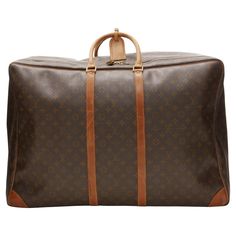 LOUIS VUITTON Sirius 70 brown LV monogram canvas large travel bag Reference: AEMA/A00080 Brand: Louis Vuitton Model: Sirius 70 Material: Canvas, Leather Color: Brown, Beige Pattern: Monogram Closure: Zip Lining: Beige Fabric Extra Details: LV logo on zipper head. Garment bag attached inside. Made in: France CONDITION: Condition: Fair, this item was pre-owned and is in fair condition. Please refer to image gallery for thorough condition check. Brown LV canvas looks great, with minor stains that m Bag Reference, Louis Vuitton Store, Zip Lining, Lv Logo, Large Travel Bag, Lv Monogram, Monogrammed Leather, Garment Bag, Beige Fabric