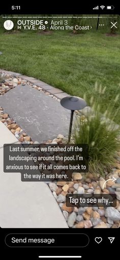 an image of a garden with rocks and gravel on the ground, in front of a house