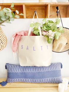 "The SALTY Oversized canvas tote bag is perfect for a trip to the beach! Also perfect to use as a reusable shopping bag, or everyday carryall. Available with text in several colors... check out the variations! This bag is made from 100% thick, sturdy canvas. AVAILABLE IN TWO SIZES * Large - 19.5\" x 13\" with a 4\" gusset *Jumbo - 23\" x 13\" with a 6\" gusset These bags are hand painted using non-toxic fabric paint. The technique used creates an attractive distressed appearance to the text that Lavender Bags For Daily Use In Summer, Lavender Bags For Everyday Summer Use, Lavender Bag For Everyday Use In Summer, Trendy Cotton Canvas Bag For Beach Season, Summer Canvas Bag With Letter Print For Shopping, Summer Cotton Canvas Bag With Letter Print, Summer Tote Beach Bag With Letter Print, Summer Letter Print Tote Beach Bag, Summer Cotton Bags With Letter Print