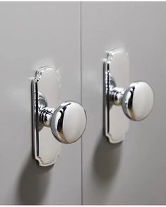 two white doors with chrome handles and knobs