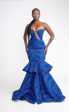 This Yetunde Corset African Print Mermaid Dress is a stunner! She's bold, beautiful and extremely gorgeous. Perfect for your occasions, birthdays, wedding, red carpet events, banquet, prom etc. This dress is 100% handmade, so you are welcome to request a customisation.  You are also welcome to request other fabric patterns. Handmade with 100% African wax cotton Care instructions: Hand wash with mild detergent. Do not bleach Zipper at the back Care Instructions Wash with Mild soap, do not bleach. Please see other beautiful African inspired clothes in our store https://www.etsy.com/uk/shop/Afrothrone Thanks for visiting our store. Ankara Long Dress, Gown Ankara, Dress To Buy, Ankara Maxi Dress, Long Gown Styles, Royalty Dress, Ankara Long Gown, Dress African Print, Ankara Long Gown Styles