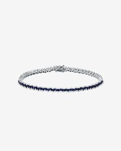 Embrace the refined charm of our Princess Mini Tennis Bracelet. This exquisite piece showcases offset princess-cut sapphires, each one carefully selected to enhance the bracelet's overall elegance. Featuring 3.20 carats of 1.5mm princess-cut dark blue sapphires, it offers versatility for stacking or stands out gracefully as a solo piece. Details 18k white gold 3.20 carats of 1.5mm princess-cut dark blue sapphires Bracelet measures 7 inches in length Box clasp with safety lock fastening 3mm width Sapphire Tennis Bracelet Fine Jewelry With Prong Setting, Classic Sapphire Bracelet With Prong Setting, Elegant Sapphire Tennis Bracelet With Brilliant Cut, Luxury Sapphire Tennis Bracelet With Brilliant Cut, Classic Sapphire Tennis Bracelet With Prong Setting, Luxury Sapphire Tennis Bracelet For Formal Occasions, Luxury White Gold Sapphire Diamond Bracelet, White Gold Sapphire Tennis Bracelet For Formal Occasions, Formal White Gold Sapphire Tennis Bracelet