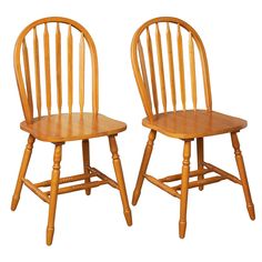 two wooden chairs sitting next to each other