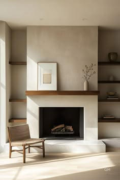 a living room with a fire place and bookshelves