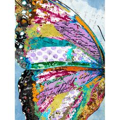 a colorful butterfly flying in the sky with lots of paint on it's wings